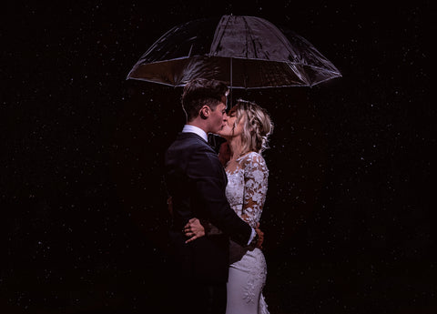 Couple Kisses Under Umbrella Wedding Austin Texas