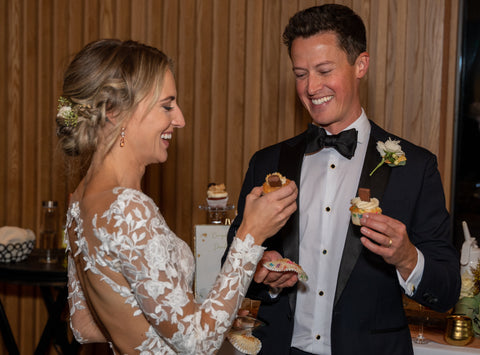 Austin Texas bride and groom make custom wedding cupcakes at reception