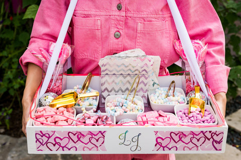 Custom roaming treats candy tray filled with pink sweets at pink disco Bat mitzvah in Austin