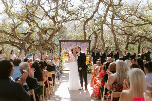 Couple walks down the aisle on wedding day in Austin, TX