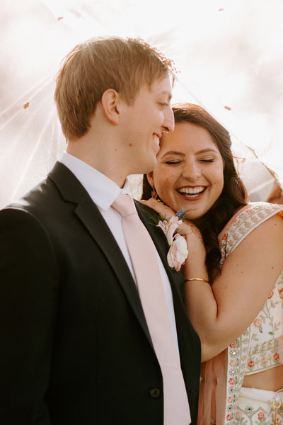 Couple embraces at fusion wedding in Austin Texas