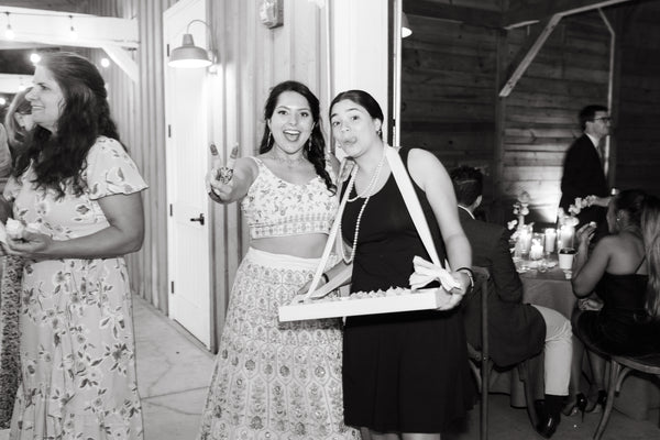 Bride smiles with Roaming Cupcake Tray at Austin, Texas wedding