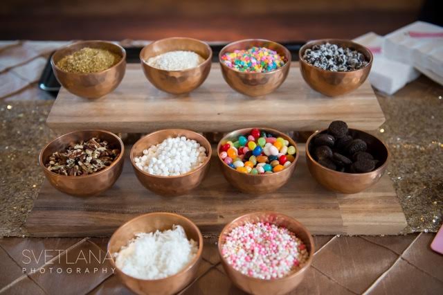 Bronze bowls filled with a variety of sweet toppings