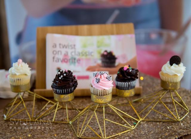 Cupcakes displayed on gold metal stand