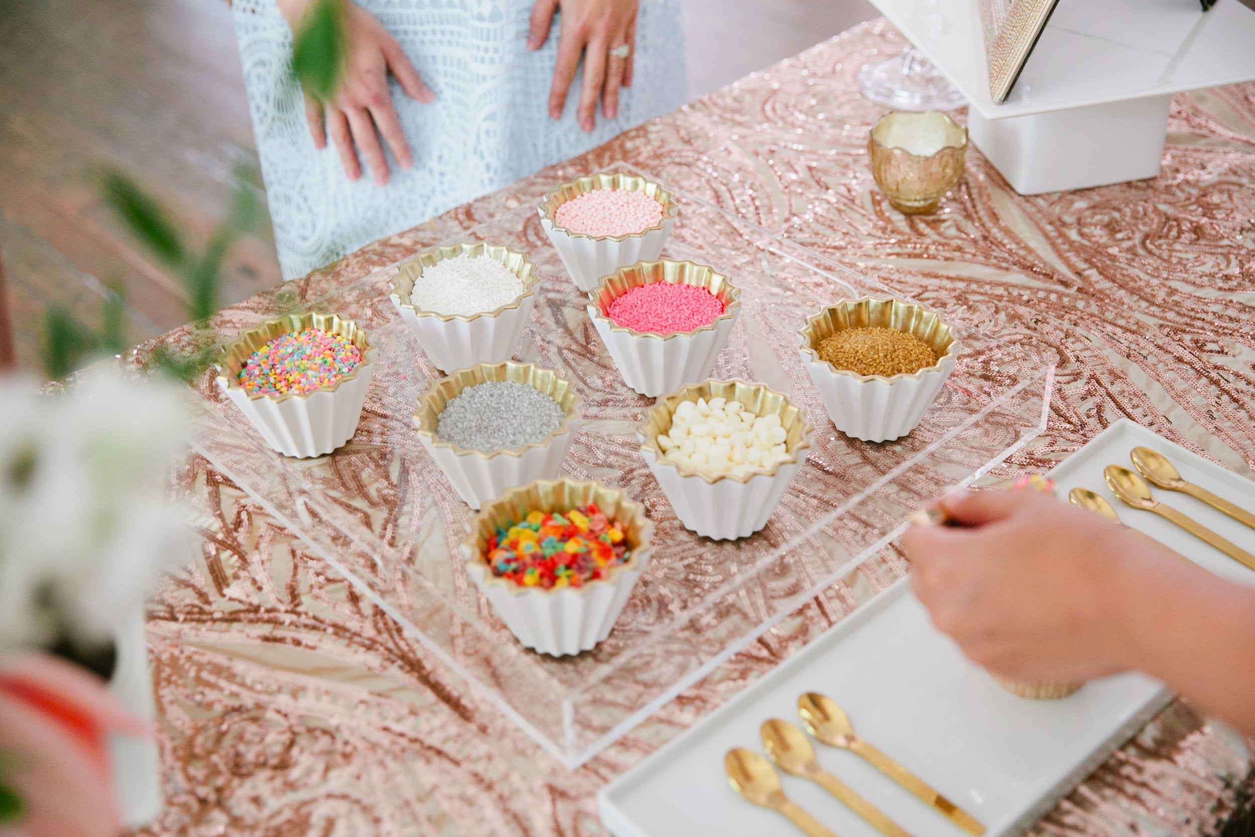 Selection of toppings at a custom cupcake bar for a wedding in Austin, Texas