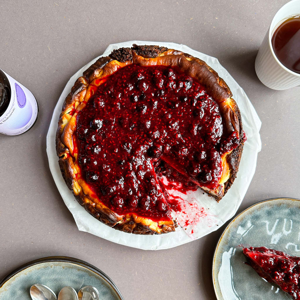 Blueberry Pomegranate Balsamic Basque Cheesecake with Slice Removed