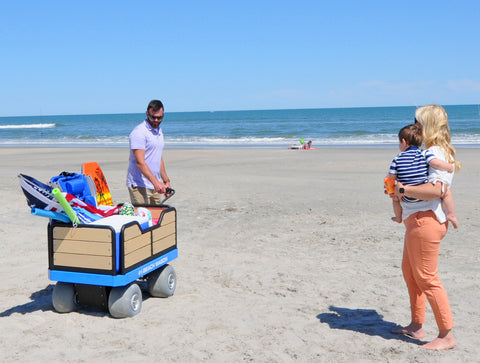 Family pulling e-Beach Wagon on beach