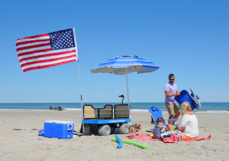 Family set up on beach with e-Beach Wagon