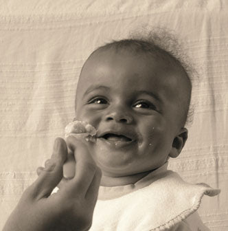 Baby eating Holle organic baby porridge - photo sent in by customer