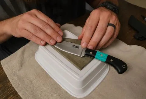 A picture of pocket knife sharpening placing on the box.