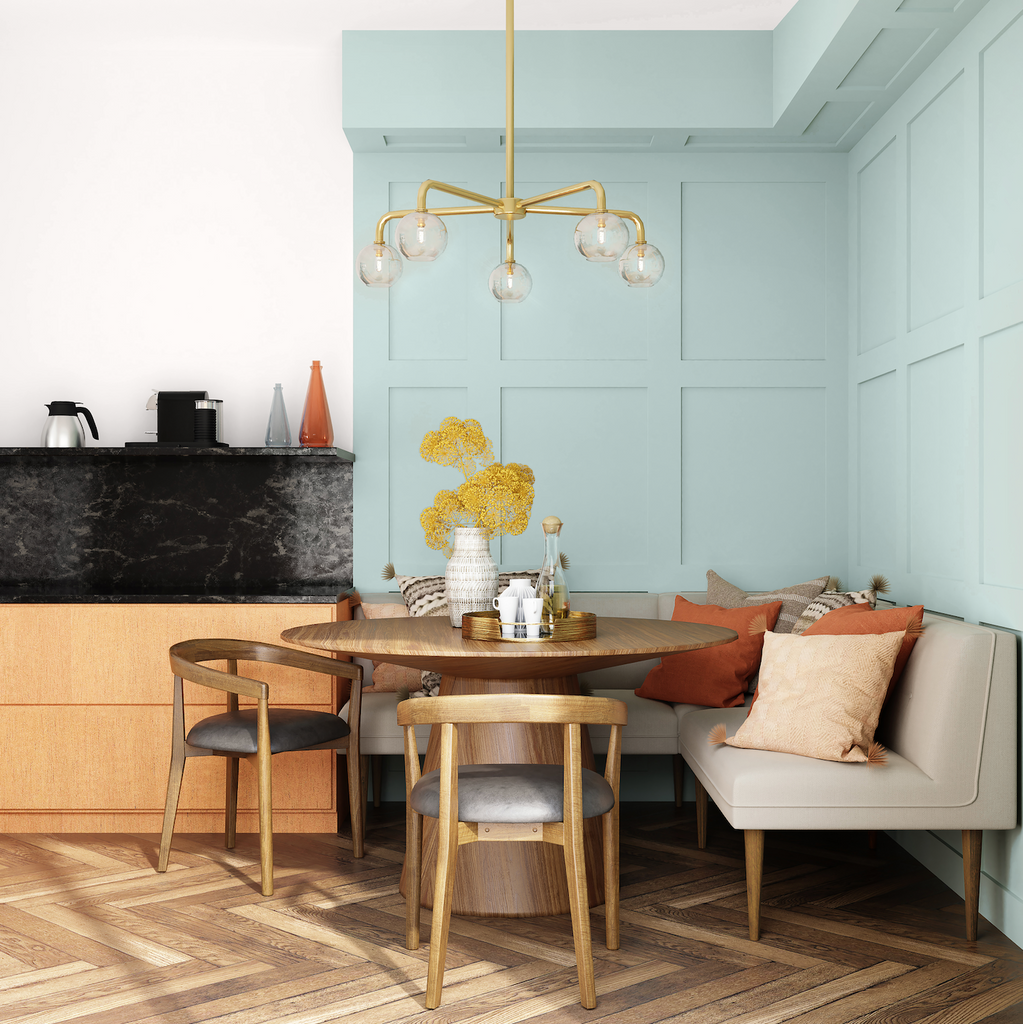 Dining area with a corner sofa, wooden table and chairs and walls painted in pale green and neutral paint colours