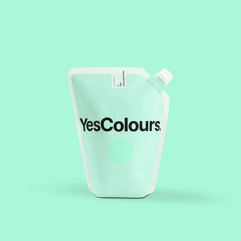 photo of a pouch with logo 'yescolours' photographed on a plain green background