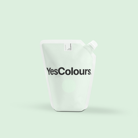 photo of a pouch with logo 'yescolours' photographed on a plain green background