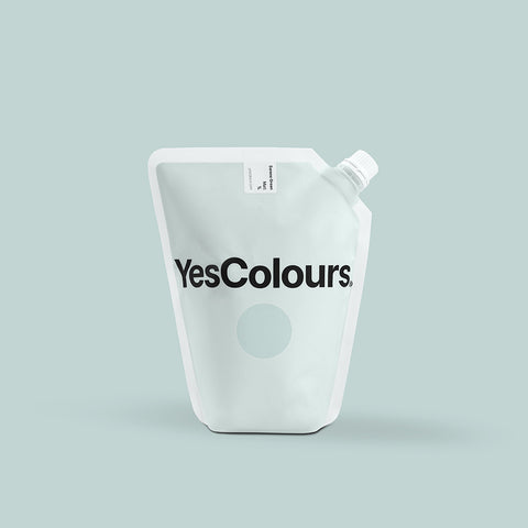 photo of a pouch with logo 'yescolours' photographed on a plain green background