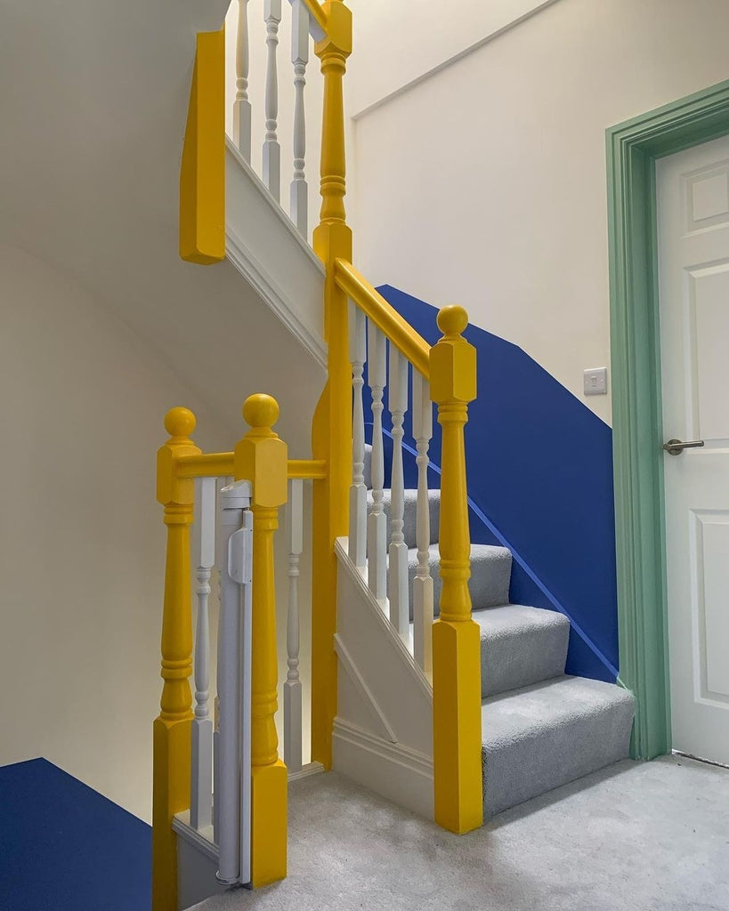 Hallway stairwell painted using colour blocking with YesColours Passionate Lilac, Passionate Yellow and Electric Mint Green colours