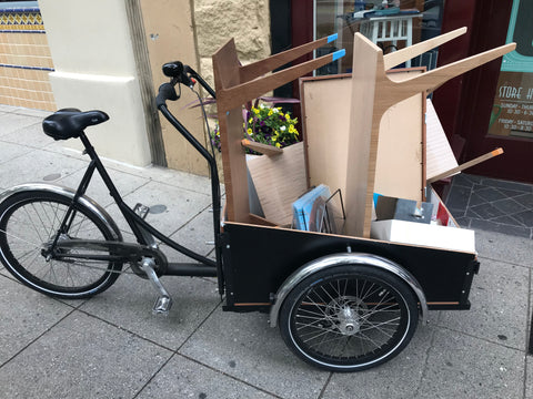 Cargo bike transporting furniture.