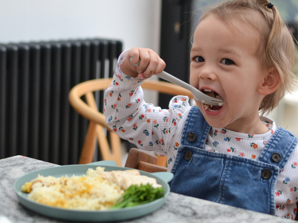 Pots for Tots eating vegetables