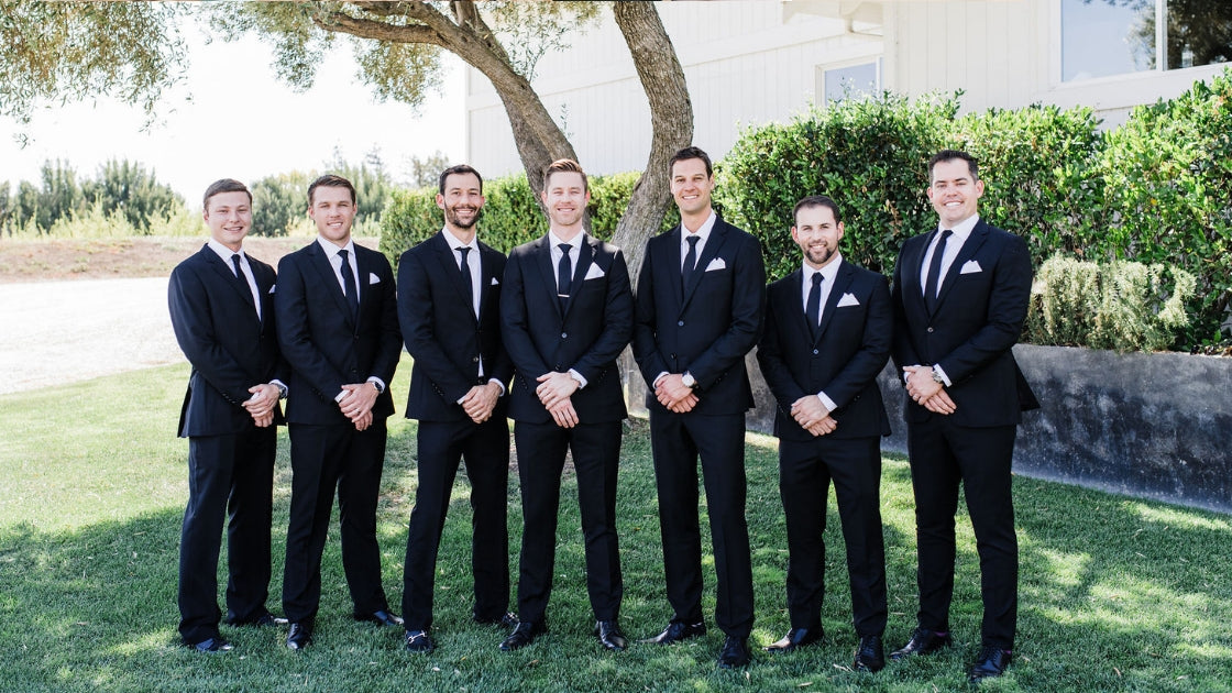 Groomsmen at wedding in black suit wedding party ceremony
