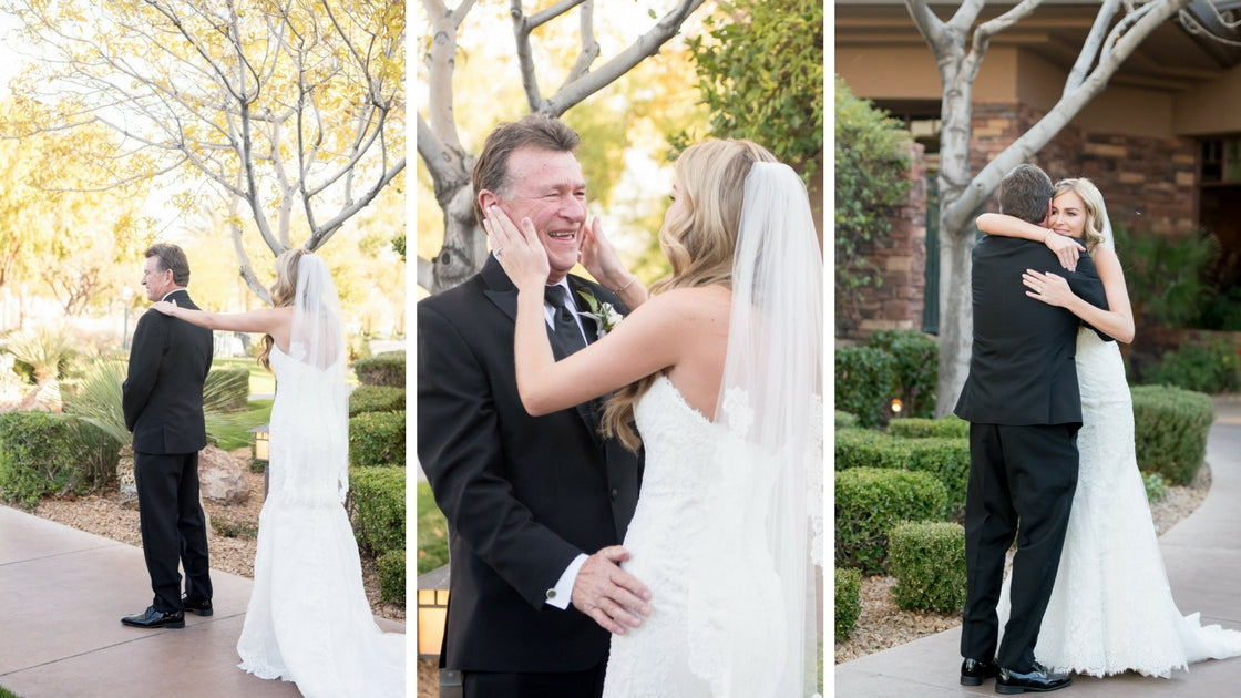 Bride hugs father and surprises him. He cries and overcome with joy for his daughter.