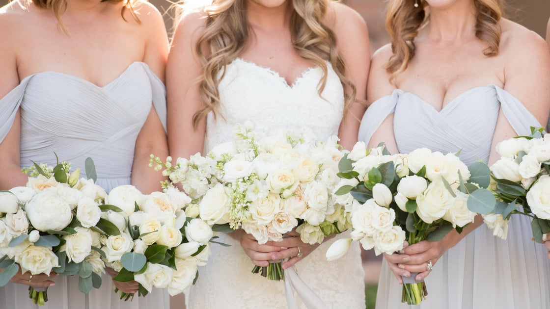 close-up of bridal gown and light grey chiffon ruched bodice of Kennedy convertible bridesmaid dress.