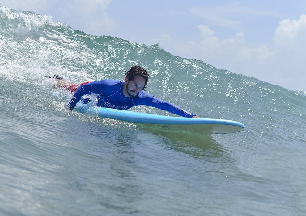 How to Paddle a Longboard and Navigate Waves