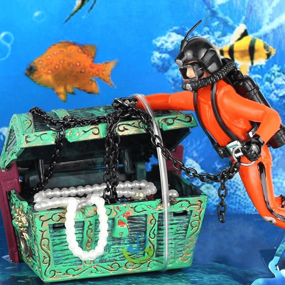aquarium ornament of a diver and treasure chest.