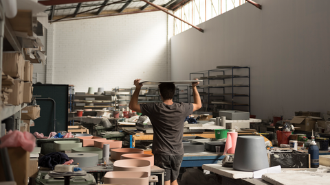 Founder Chris, walking through Nood Co warehouse.