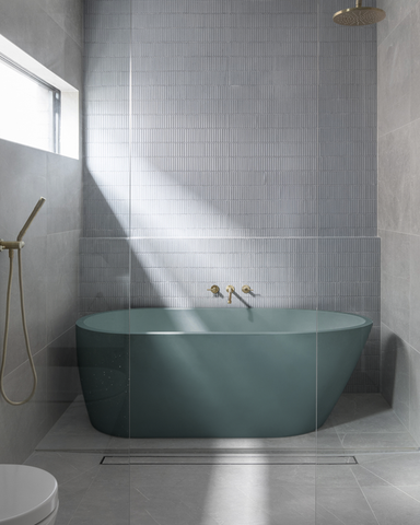 Juno bathtub in the colour Rowboat in a bathroom setting with blue tiles.