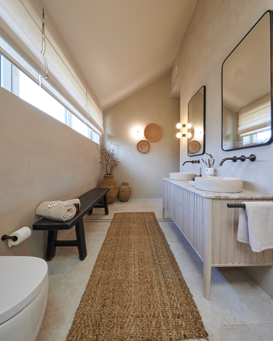 A beautifully designed second bathroom featuring a 'Nood' Slip basin, adding a touch of sophistication to the space.