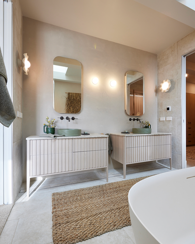 A bathroom with double vanities, both featuring Nood Co's stylish Slip basins in Olive.