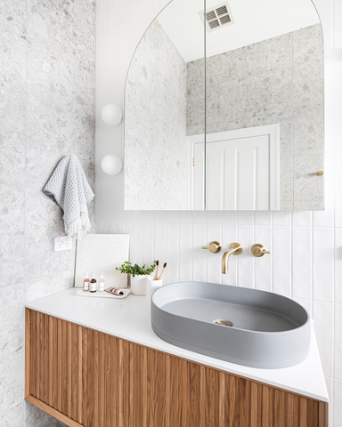 Photograph showcasing the main bathroom renovation by Georgia Neale for M.J. Harris Group, featuring the Nood Co Pill Basin in Sky Grey, photographed by J-HAZ. This image highlights the modern, sophisticated design of the bathroom, focusing on the sleek Pill Basin set against a backdrop of tasteful decor and contemporary finishes, reflecting a perfect blend of functionality and style.