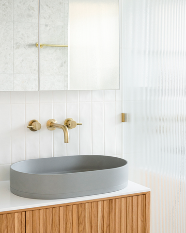 Photograph showcasing the main bathroom renovation by Georgia Neale for M.J. Harris Group, featuring the Nood Co Pill Basin in Sky Grey, photographed by J-HAZ. This image highlights the modern, sophisticated design of the bathroom, focusing on the sleek Pill Basin set against a backdrop of tasteful decor and contemporary finishes, reflecting a perfect blend of functionality and style.