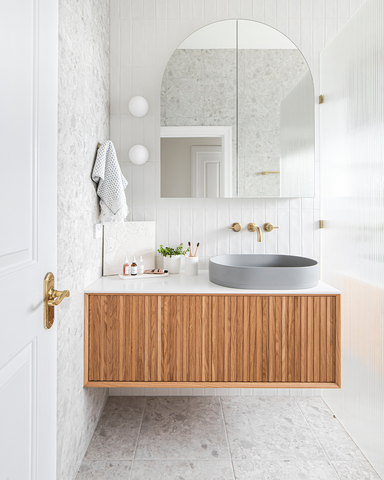 Photograph showcasing the main bathroom renovation by Georgia Neale for M.J. Harris Group, featuring the Nood Co Pill Basin in Sky Grey, photographed by J-HAZ. This image highlights the modern, sophisticated design of the bathroom, focusing on the sleek Pill Basin set against a backdrop of tasteful decor and contemporary finishes, reflecting a perfect blend of functionality and style.