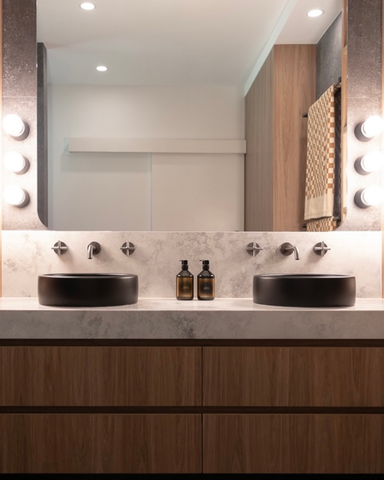 Front view of the wall-to-wall vanity in the Pepe Nero project by Giulia Nozzoli, showcasing dual Charcoal Bowl basins by Nood Co. The elegant setup is complemented by sleek tapware, emphasising the sophisticated and modern design of the space.