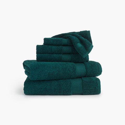 https://cdn.shopify.com/s/files/1/0557/8840/4900/products/classic-organic-cotton-bath-towel-deep-teal-green-bundle_large.jpg?v=1684518009