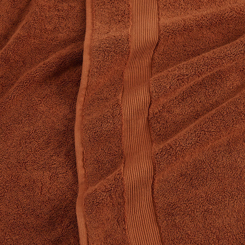 https://cdn.shopify.com/s/files/1/0557/8840/4900/products/classic-organic-cotton-bath-towel-rust-red-detail_large.jpg?v=1687377524