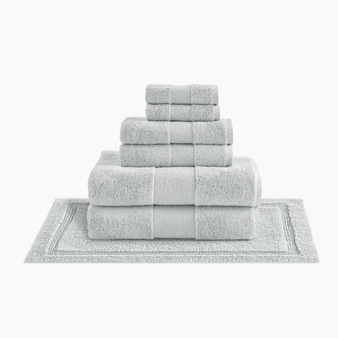 https://cdn.shopify.com/s/files/1/0557/8840/4900/products/plush-organic-cotton-reversible-bath-rug-bundle-oyster-gray_large.jpg?v=1685459040