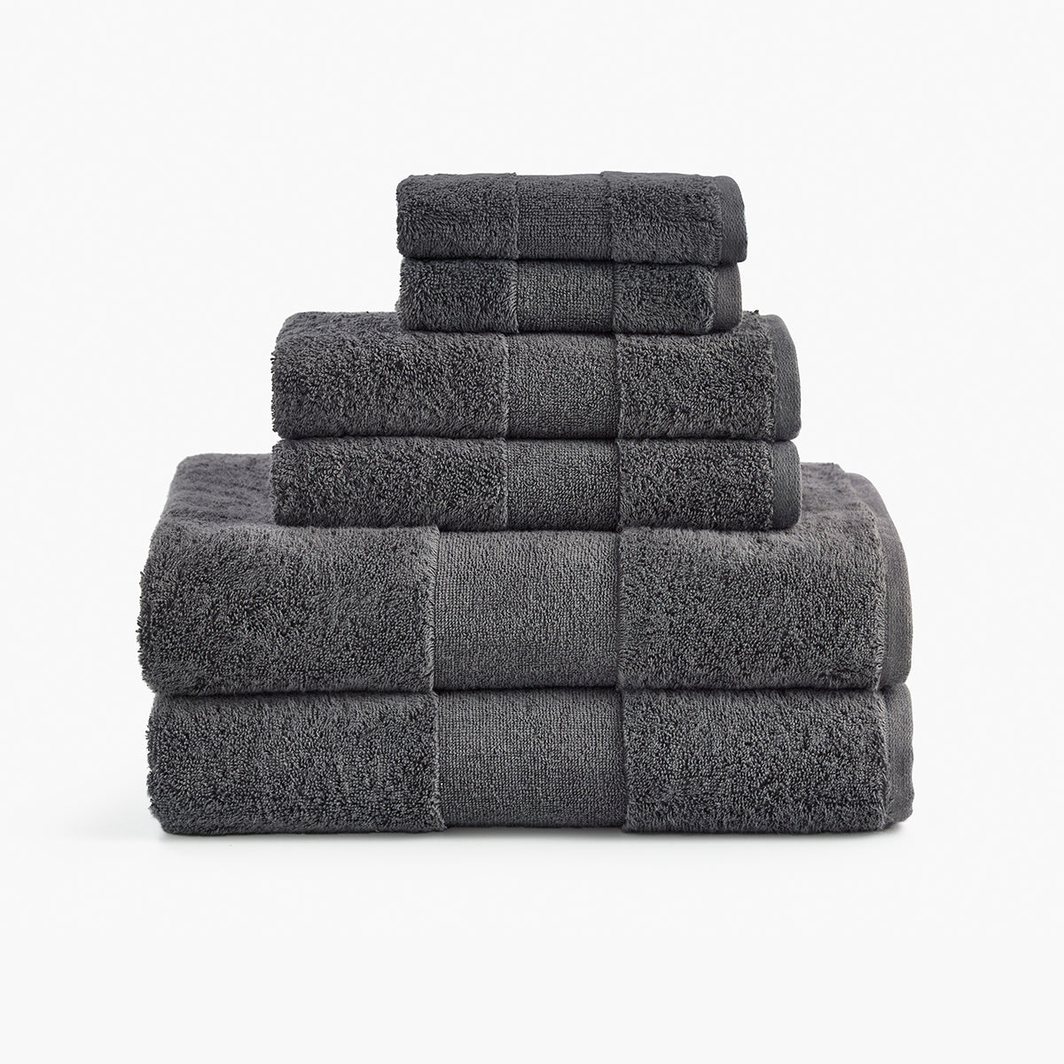 https://cdn.shopify.com/s/files/1/0557/8840/4900/products/plush-organic-cotton-reversible-bath-rug-bundle-smoke-gray-towels_1200x.jpg?v=1685459145