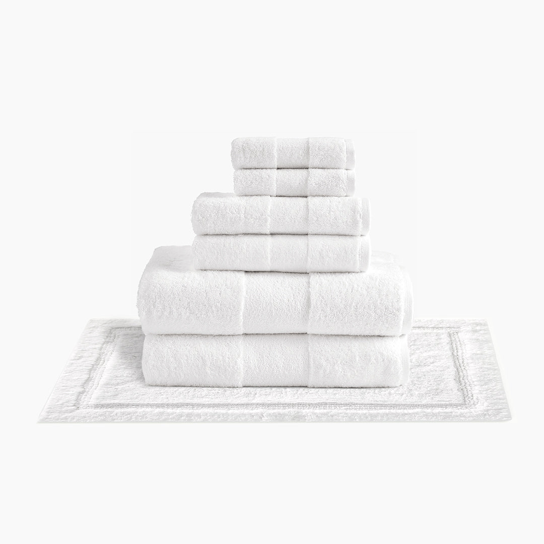 https://cdn.shopify.com/s/files/1/0557/8840/4900/products/plush-organic-cotton-reversible-bath-rug-bundle-white_1200x.jpg?v=1685459228