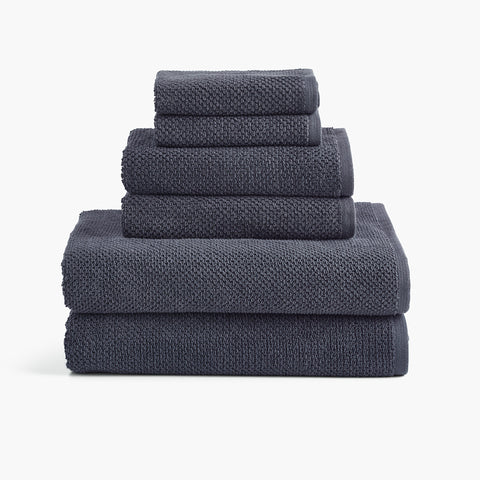 https://cdn.shopify.com/s/files/1/0557/8840/4900/products/textured-organic-cotton-bath-rug-bundle-charcoal-gray-towel-set_large.jpg?v=1684872546