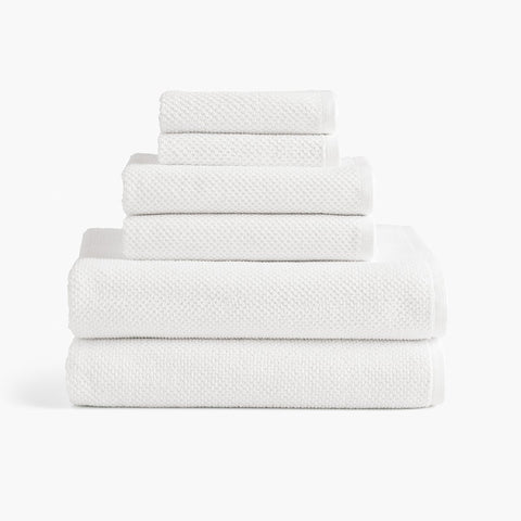 https://cdn.shopify.com/s/files/1/0557/8840/4900/products/textured-organic-cotton-bath-towels-white-set_large.jpg?v=1684874275