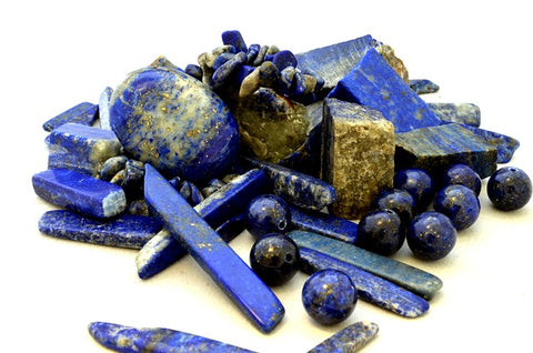 Polished and raw apis lazuli in various shades of blue and gold