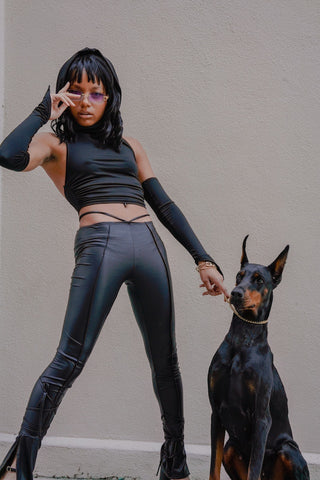 y2k fashion women with leather and doberman dog