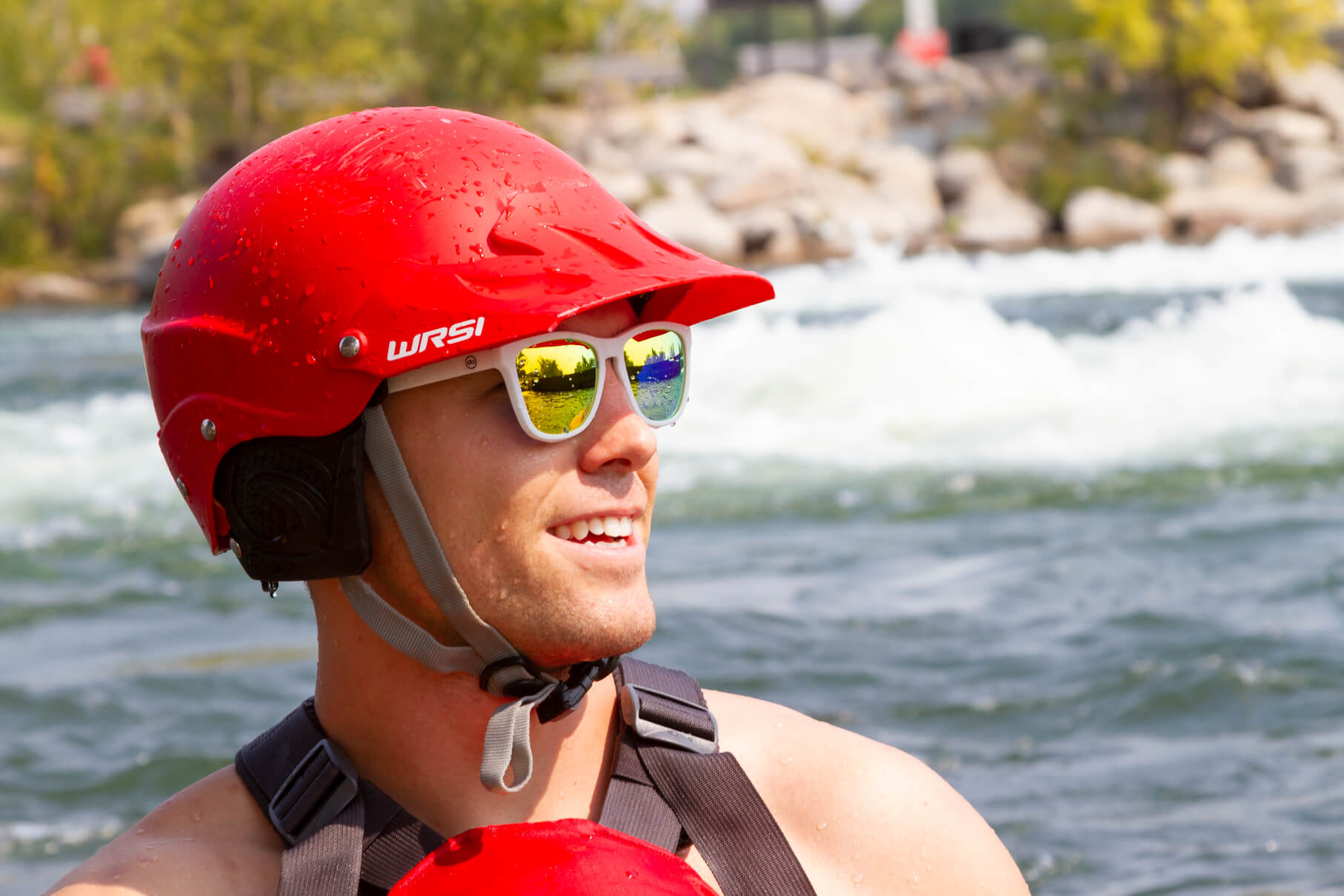 a kayaker wearing white sunglasses