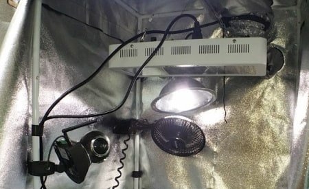 This is a picture of exhaust fans, oscillating fans, and ducting used for active airflow inside a grow tent.