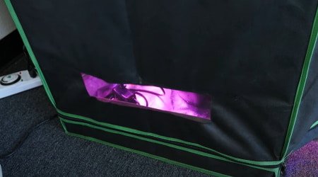 This is a picture of a grow tent with an open vent used for passive airflow.