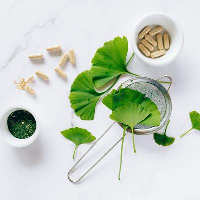 Ginkgo Leaves and a Strainer with pill capsules