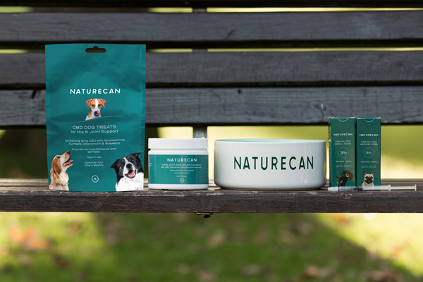 Full Range of CBD pets products and dog food bowl on bench