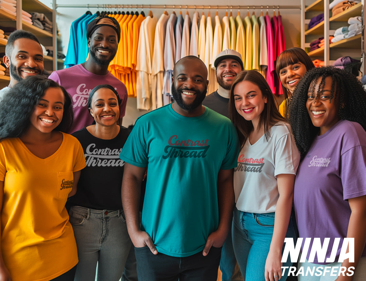 T-shirt business owner posing for photos with a group of happy employees