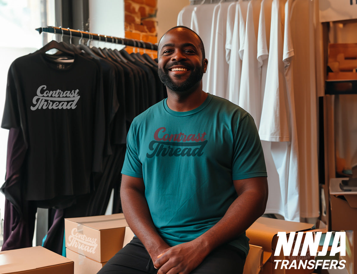 T-shirt business owner sitting proudly with boxes of t-shirts ready to ship